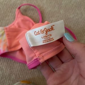 1 cat and jack target swimsuit top and 2 target swimsuit bottoms all size large